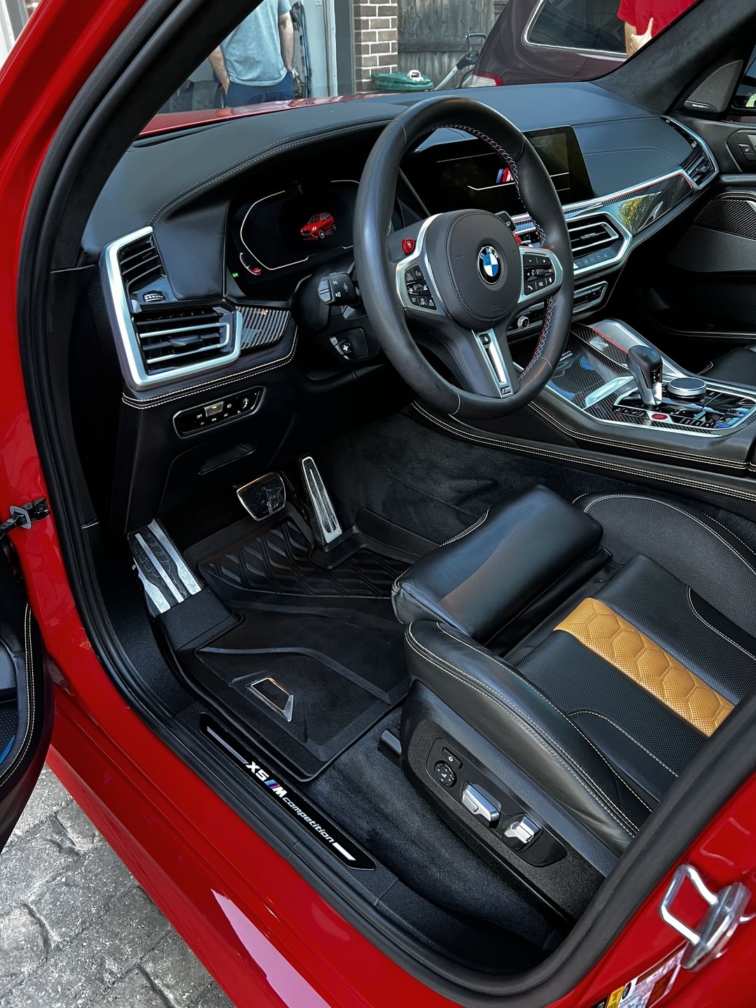 After detail — BMW X5 interior, spotless carpet, clean door sill, salt removed